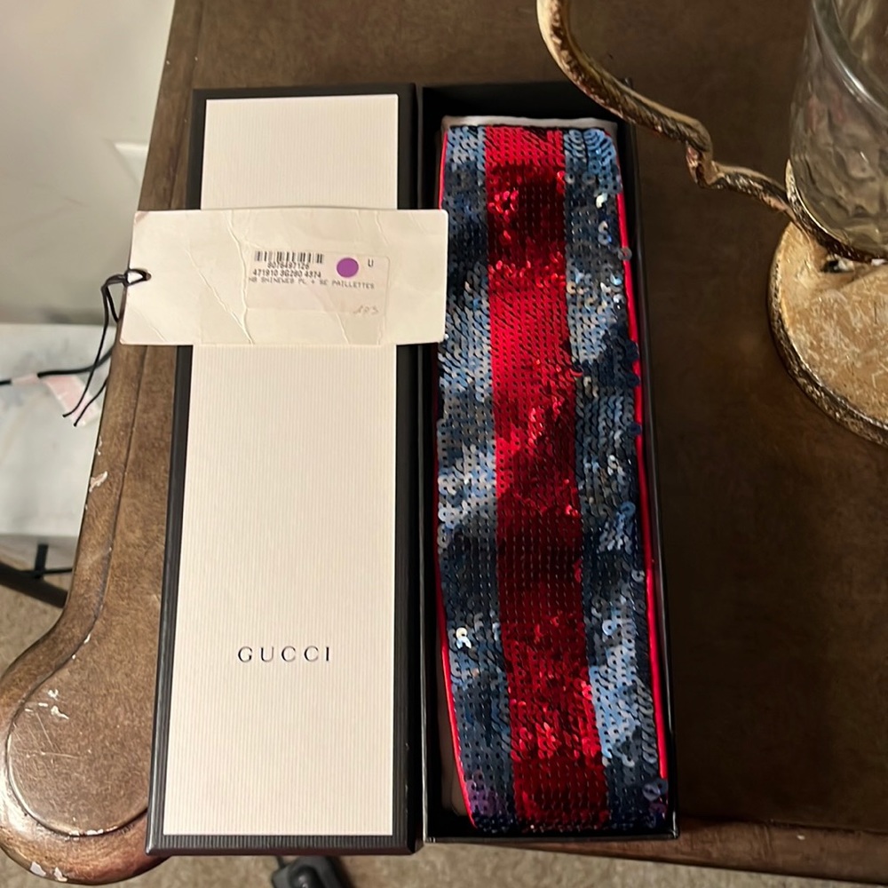An authentic Gucci headband. Worn a couple of times. stains inside of headband.